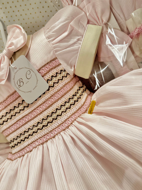 A “Pink princess smocked dress”